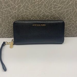 M. K. wallet color Black.  used but in good condition